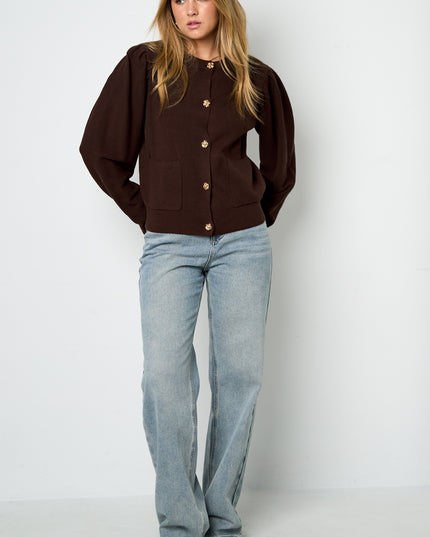 Vest met bloemen knopen