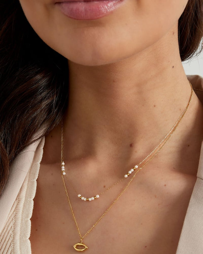 dubbele ketting kus met parel