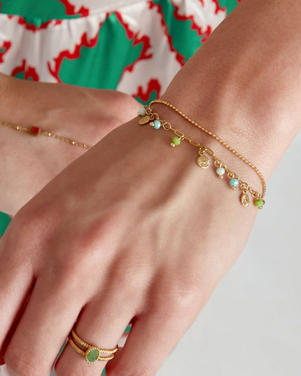 Armband met muntjes en kralen - roze/Goud kleur 