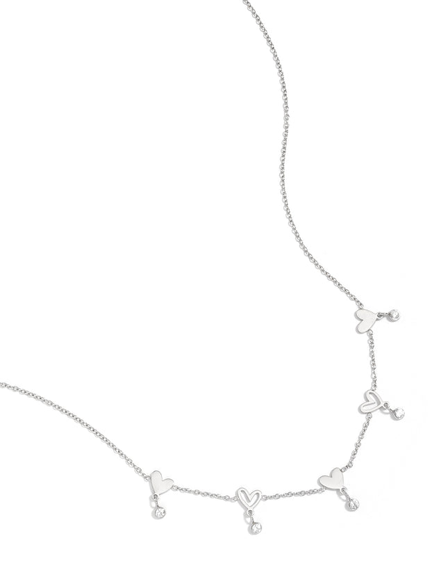 Ketting met wisselende hartjes en hangende steentjes