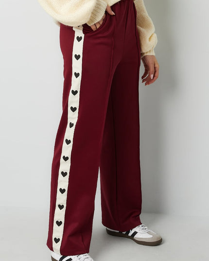 Pants with hearts on the side - red