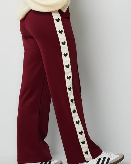 Pants with hearts on the side - red