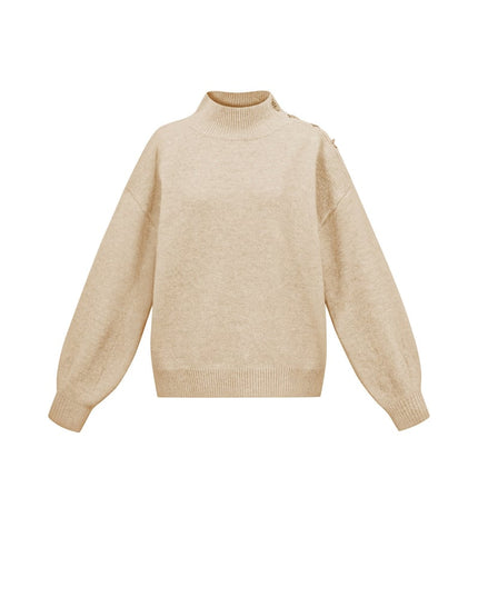 Trui met knopen op de schouder