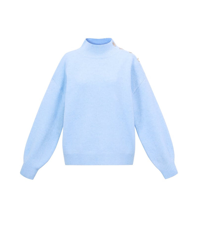 Trui met knopen op de schouder