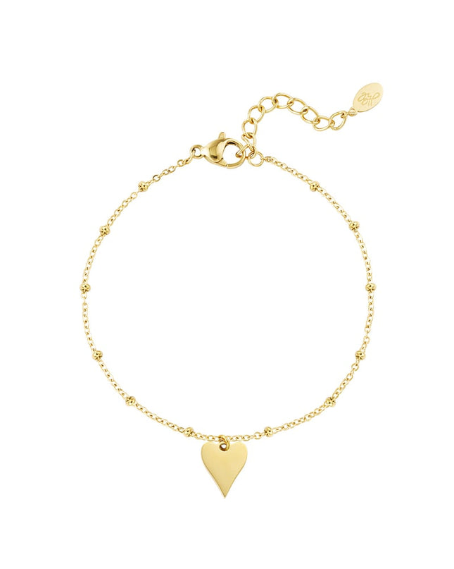 armband met bolletjes en hartbedel