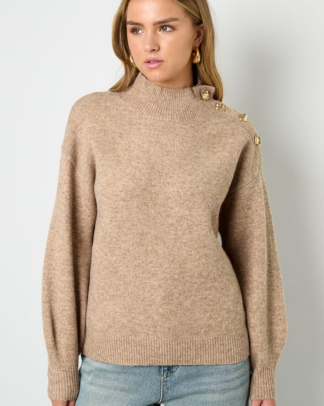 Trui met knopen op de schouder