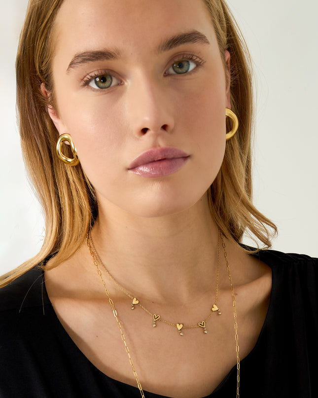Ketting met wisselende hartjes en hangende steentjes