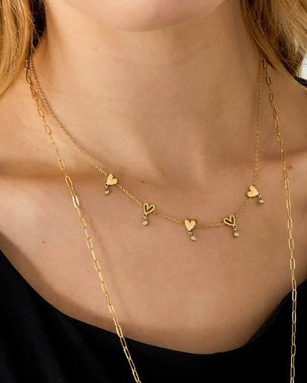 Ketting met wisselende hartjes en hangende steentjes
