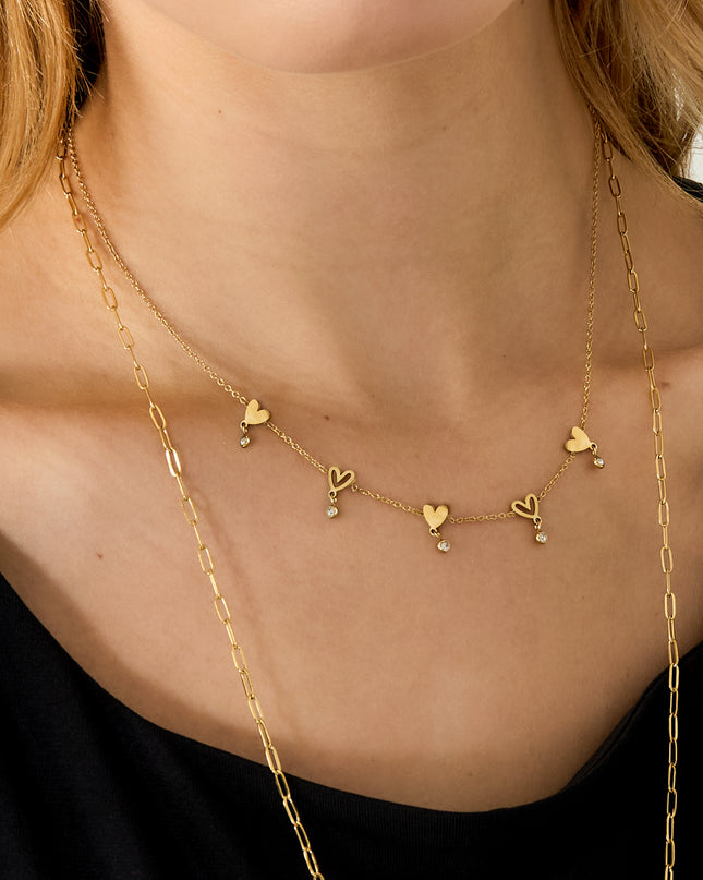 Ketting met wisselende hartjes en hangende steentjes