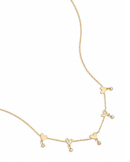Ketting met wisselende hartjes en hangende steentjes