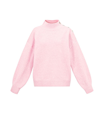 Trui met knopen op de schouder